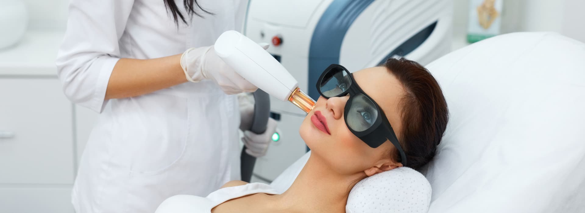 A beautiful woman is having laser hair removal.