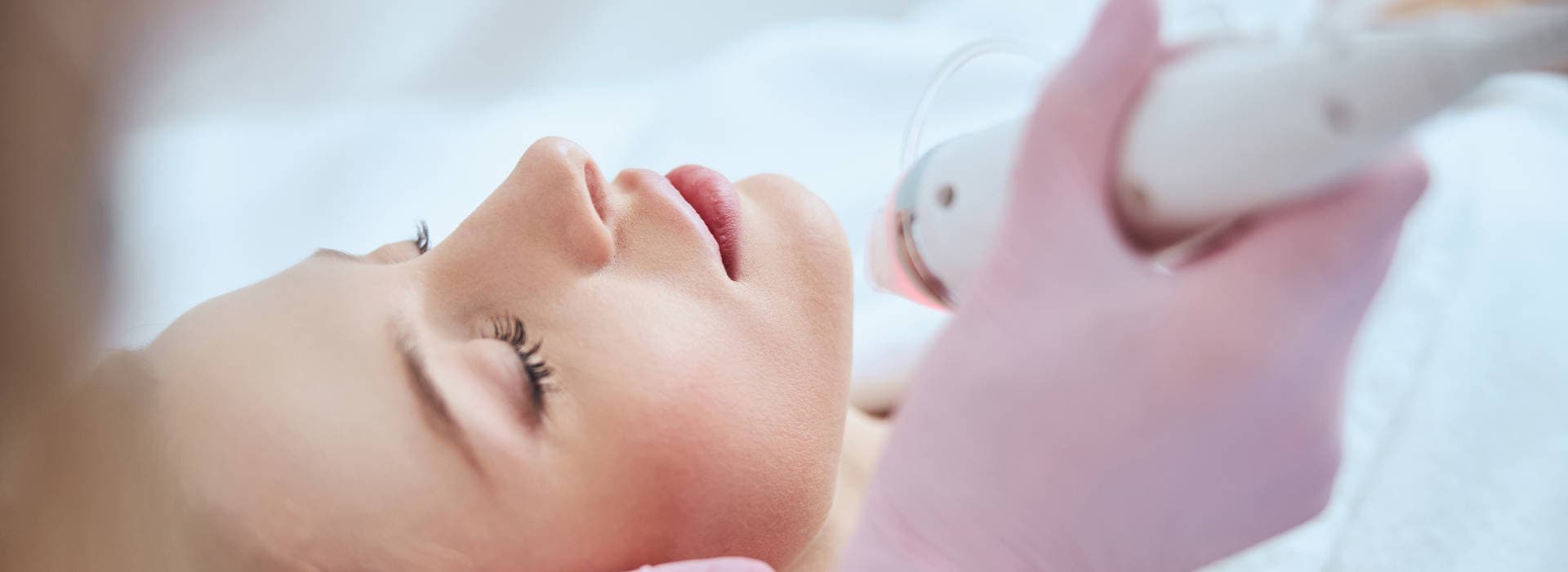 A woman is having Microneedling treatment.